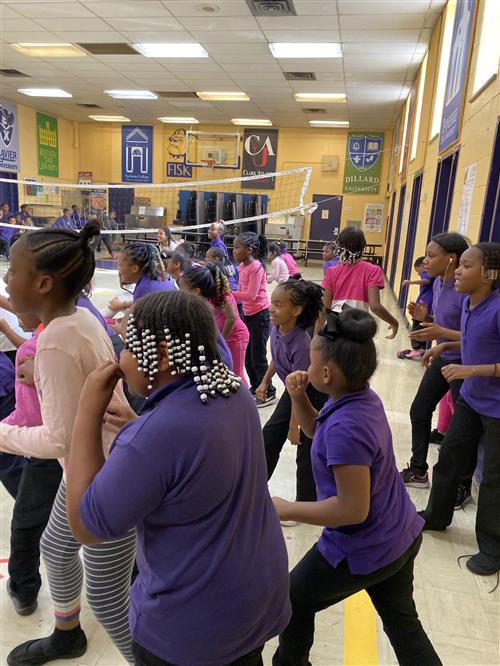 Female students competing in gym activities during healthy kids. 